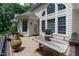 Outdoor deck with grill and table, perfect for entertaining, with backyard and large home windows at 5920 Two Pines Trl, Wake Forest, NC 27587