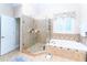 A bathroom with glass shower and soaking tub at 5920 Two Pines Trl, Wake Forest, NC 27587