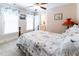Charming bedroom boasts floral bedding, natural light, and ensuite bathroom access for added privacy at 5920 Two Pines Trl, Wake Forest, NC 27587