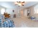 Bright open room features neutral walls, carpet, french doors, and ample space for versatile use at 5920 Two Pines Trl, Wake Forest, NC 27587