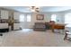 Spacious bonus room with neutral carpet, ceiling fan and plenty of natural light from multiple windows at 5920 Two Pines Trl, Wake Forest, NC 27587