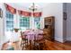 Cozy breakfast nook featuring a round table, wooden chairs, natural light, and a chandelier at 5920 Two Pines Trl, Wake Forest, NC 27587