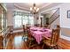 Elegant dining room with hardwood floors, a chandelier, and views of the front entry, perfect for gatherings at 5920 Two Pines Trl, Wake Forest, NC 27587