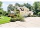 A well-maintained home featuring a side entry garage and mature landscaping at 5920 Two Pines Trl, Wake Forest, NC 27587