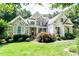 Charming home with stone accents, manicured lawn, and inviting front porch at 5920 Two Pines Trl, Wake Forest, NC 27587
