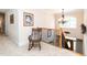 Second floor hallway showcases neutral carpet, wooden railing with wrought iron details, and rocking chair at 5920 Two Pines Trl, Wake Forest, NC 27587