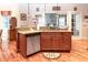 A kitchen with custom cabinets, hardwood floors, stainless appliances, and granite countertops at 5920 Two Pines Trl, Wake Forest, NC 27587