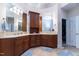 Main bathroom with double sinks, wooden cabinetry, tile floors and countertop at 5920 Two Pines Trl, Wake Forest, NC 27587