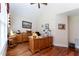 The office features wood floors, a ceiling fan, and a desk with built in shelving and plenty of room to work at 5920 Two Pines Trl, Wake Forest, NC 27587