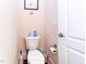 A powder room featuring a toilet and door at 5920 Two Pines Trl, Wake Forest, NC 27587