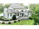 Aerial view of the rear exterior featuring a deck and well-maintained landscaping at 5920 Two Pines Trl, Wake Forest, NC 27587