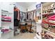 A walk-in closet offers shelves and rod space for storage at 5920 Two Pines Trl, Wake Forest, NC 27587