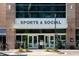 Exterior of Sports & Social apartments in the district, showcasing its modern architecture and prime location at 600 Hedrick Ridge Road # 310 209, Cary, NC 27519