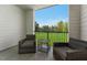 Charming balcony with stylish outdoor seating, perfect for enjoying the serene green landscape at 600 Hedrick Ridge Road # 310 209, Cary, NC 27519