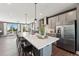 Modern kitchen boasts stainless steel appliances, quartz countertops, large island and adjacent to living area at 600 Hedrick Ridge Road # 310 209, Cary, NC 27519