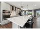Bright kitchen features stainless steel appliances, sleek cabinetry, a spacious island with barstool seating at 600 Hedrick Ridge Road # 310 209, Cary, NC 27519