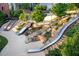 Community playground featuring multiple slides and climbing structures for of all ages to enjoy in a park-like setting at 600 Hedrick Ridge Road # 310 209, Cary, NC 27519