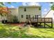 Backyard view of the home with a wooden deck, showcasing the outdoor living space at 603 Everglades Dr, Mebane, NC 27302