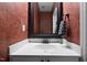 Stylish half bathroom featuring a decorative mirror and sink at 603 Everglades Dr, Mebane, NC 27302