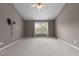 Bedroom with lots of natural light and mount for TV at 603 Everglades Dr, Mebane, NC 27302