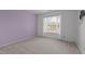 Bedroom with purple walls and a bright window at 603 Everglades Dr, Mebane, NC 27302