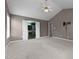Spacious bedroom with gray walls, neutral carpet, and a view into the bright, green bathroom at 603 Everglades Dr, Mebane, NC 27302