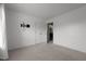 A bright bedroom features a closet, TV mount, and neutral carpet flooring at 603 Everglades Dr, Mebane, NC 27302