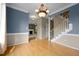 Open dining room shows hardwood floors and access to stairs and living area at 603 Everglades Dr, Mebane, NC 27302