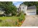 Charming two-story home featuring manicured landscaping and a welcoming front entrance and attached garage at 603 Everglades Dr, Mebane, NC 27302