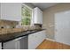 Charming kitchen featuring stainless steel appliances, tile backsplash, and granite countertops at 603 Everglades Dr, Mebane, NC 27302