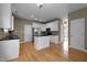 Modern kitchen with center island, stainless appliances, granite countertops and white cabinetry at 603 Everglades Dr, Mebane, NC 27302