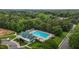 Enjoy this community pool with a bath house and a wooded backdrop, perfect for relaxation and recreation at 603 Everglades Dr, Mebane, NC 27302