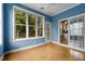 Bright sunroom with large windows, hardwood floors and views of the backyard at 603 Everglades Dr, Mebane, NC 27302