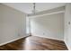 Bright bedroom features hardwood floors, natural light from a window, and neutral paint at 606 Oak Tree Dr, Chapel Hill, NC 27517