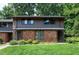 Charming townhome featuring a brick facade and manicured lawn at 606 Oak Tree Dr, Chapel Hill, NC 27517