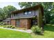 Townhome exterior with a brick facade and green lawn at 606 Oak Tree Dr, Chapel Hill, NC 27517