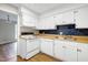 Functional kitchen with white cabinets and appliances, and tile backsplash at 606 Oak Tree Dr, Chapel Hill, NC 27517