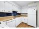 Well-lit kitchen featuring white appliances and ample counter space at 606 Oak Tree Dr, Chapel Hill, NC 27517