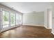 Spacious living room with natural light and wood laminate floors at 606 Oak Tree Dr, Chapel Hill, NC 27517