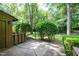View of a patio with mature landscaping enhancing the outdoor living space's appeal at 606 Oak Tree Dr, Chapel Hill, NC 27517