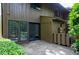 View of patio with double doors and window showcasing outdoor living and a blend of brick and siding at 606 Oak Tree Dr, Chapel Hill, NC 27517