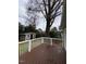 View of the back deck and fenced yard that includes a storage shed at 627 New Road, Raleigh, NC 27608