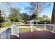 Inviting backyard deck perfect for entertaining, complete with a charming shed and lush landscaping at 627 New Road, Raleigh, NC 27608