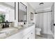 Spacious bathroom features double sinks, marble floors, and updated finishes at 627 New Road, Raleigh, NC 27608