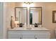 Updated bathroom featuring double sinks, granite countertops, and modern fixtures at 627 New Road, Raleigh, NC 27608