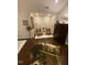 A guest bedroom features hardwood floors, seating, and decor at 627 New Road, Raleigh, NC 27608
