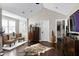 A bedroom showcases a seating area, a chest, and an abundance of space at 627 New Road, Raleigh, NC 27608
