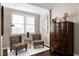 A bedroom features hardwood floors, comfortable seating, and neutral tones at 627 New Road, Raleigh, NC 27608