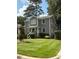 Inviting two-story house featuring a well-kept lawn and charming curb appeal at 627 New Road, Raleigh, NC 27608