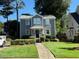 Charming two-story home with gray siding, manicured lawn, and inviting curb appeal at 627 New Road, Raleigh, NC 27608